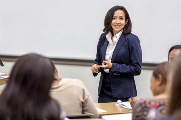 Accounting professor teaching in front of class.