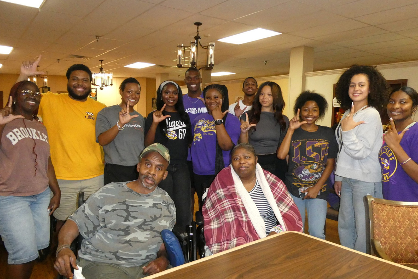 NABA students in front of a backdrop
