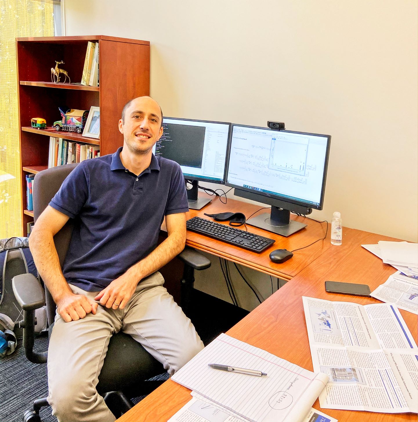 Daniel Keniston smiles in office.