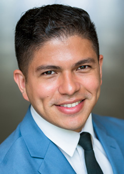 Headshot of Francidvo Moreno Gonzalez. He is wearing a blue suit. 