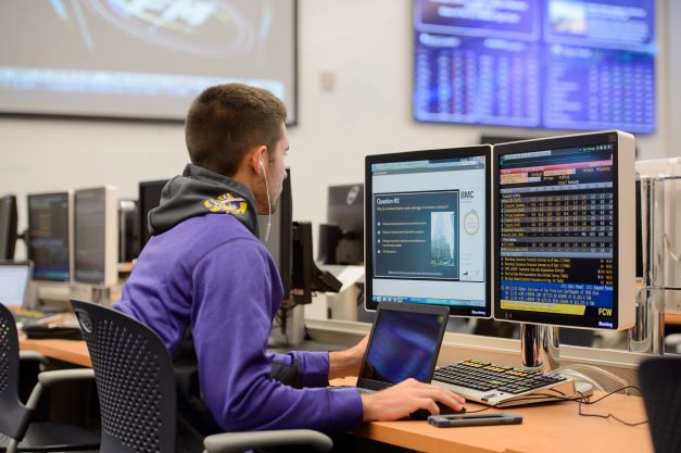 Student working at computer station in SMART lab