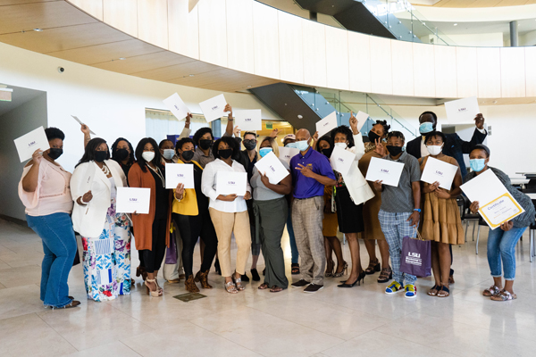 Bootcamp group smile with their certificates