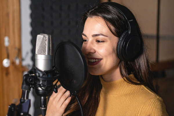student speaking into a microphone