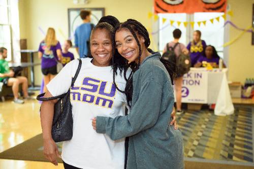 Mother and daughter posing together