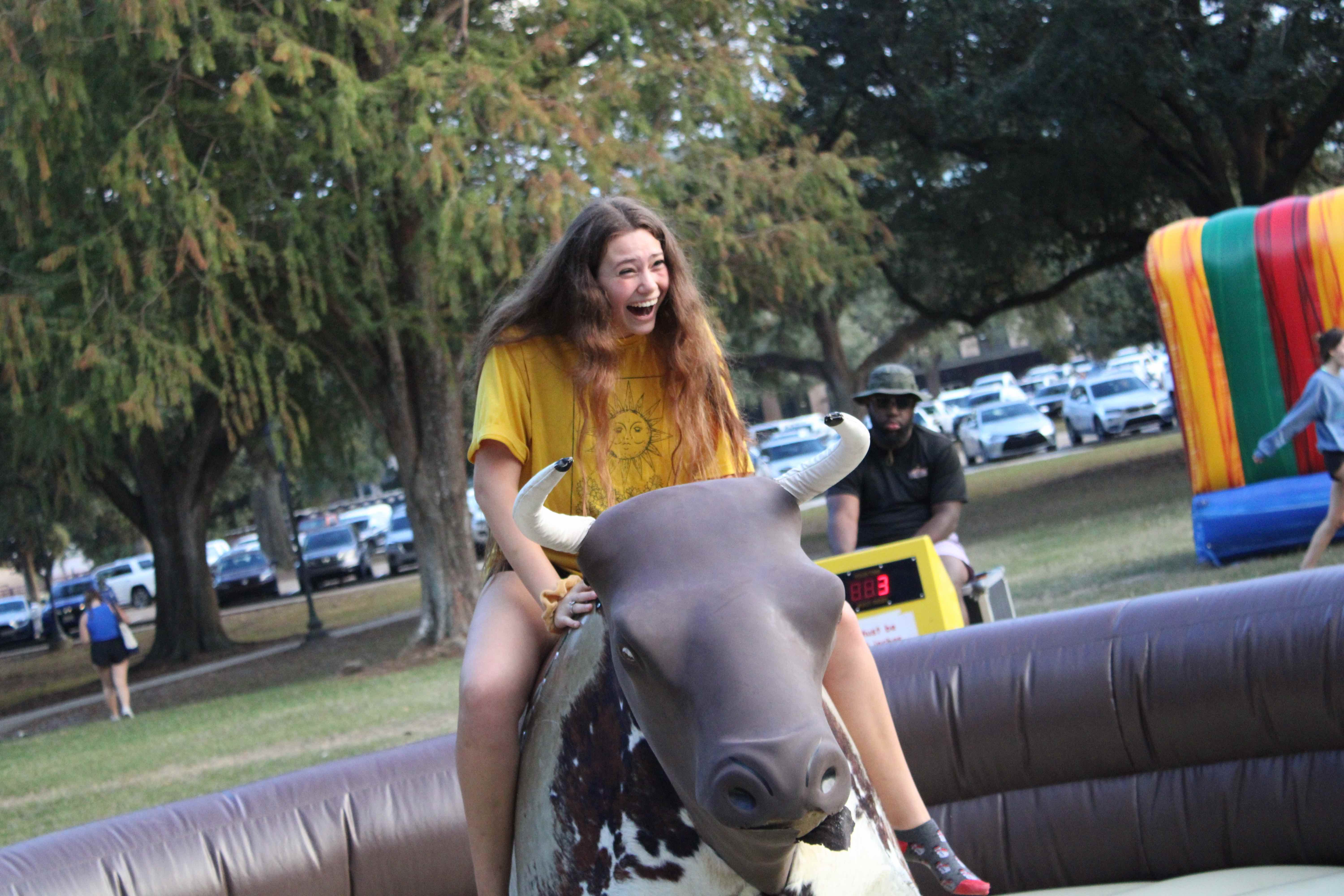 Resident rides a mechanical bull