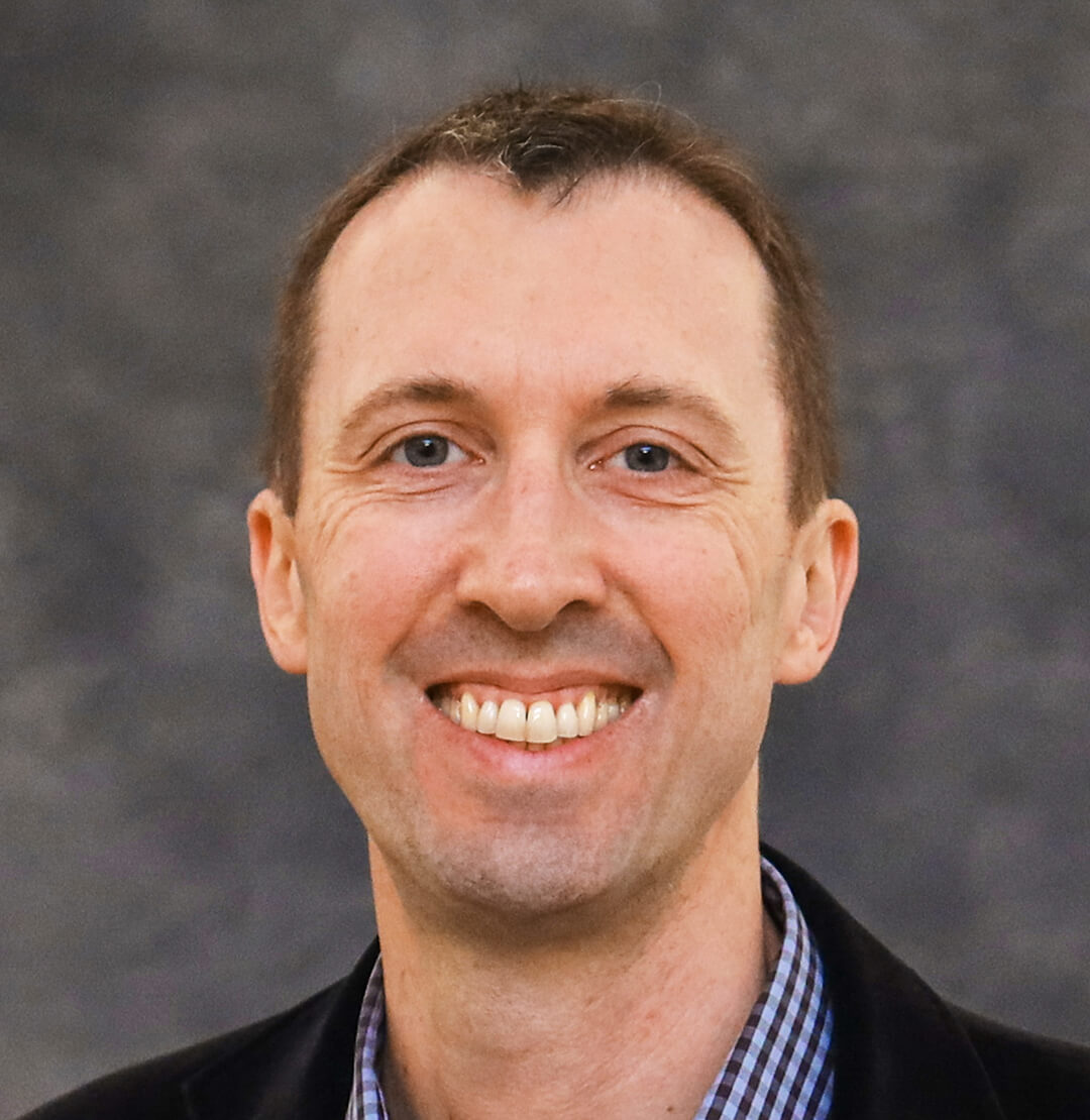 Headshot of panelist Owen Carmichael